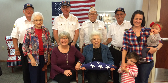 Seated—Seeland Park resident Jane Thompson holding the flag in honor of her late husband and veteran, Don Thompson with her daughter, Claudia Brammer from Rosemount, Minnesota. Standing L-R: Dorothy Peak, Don Thompson’s sister; Larry Ellis, Ron Davis, Ed Adkins, George Fowler, and Jane’s granddaughter, Danae (Carroll) Hewitt with her daughters, Sadie and Ruthie from Ankeny.