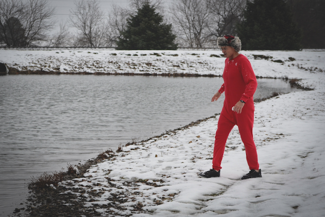 Jeff Menary, Grinnell Mutual executive vice president of line operations, takes the long, cold walk to the Grinnell Mutual Reinsurance pond to uphold his part of the challenge to support GRMC’s Community Care Clinic. 
