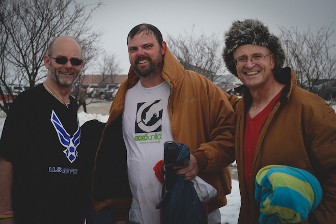 No Shave No Heels November squad leader Ron Nott (right), project lead Matt Petersen (center), and joined Jeff Menary (right) for a plunge into the pond behind Grinnell Mutual as part of the challenge that raised more than $4,100 for the Community Care Clinic. 