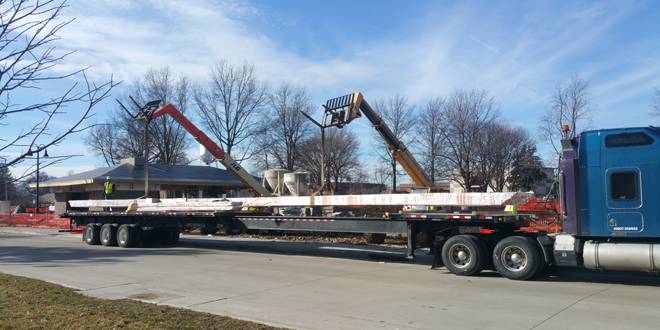  A long trailer was needed to haul 80 feet long curved glued laminated beam from Sentinel Structures in Peshtigo to Grinnell, Iowa.